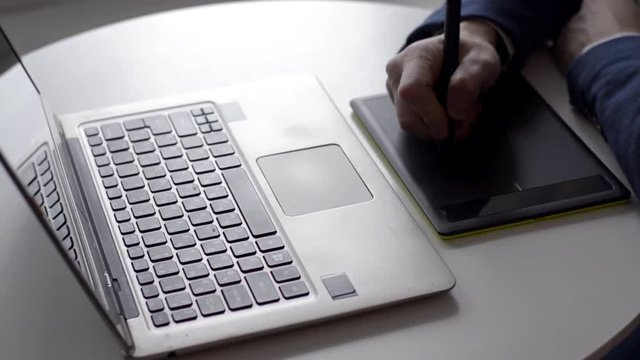 Graphic designer using digital tablet