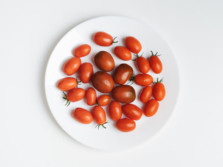 tomatoes on a white plate. white background. food photography, 