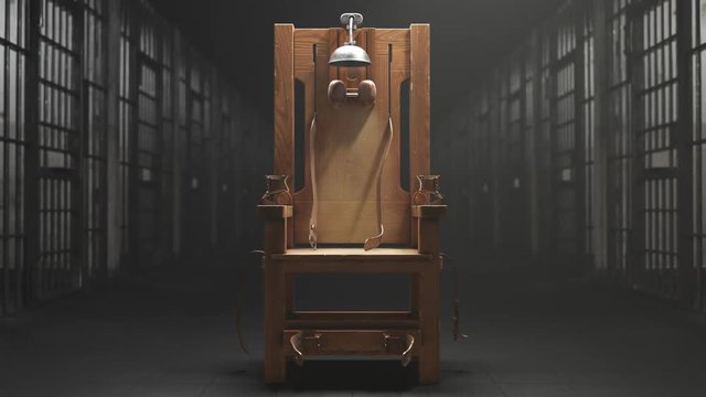 Wooden electric chair in the spotlight in a prison block. Vertigo shot. 4K HD