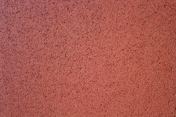 orange texture rubber save covering for childrens playgrounds.