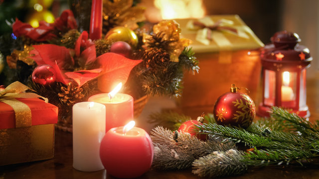 Beautiful image for winter celebrations with burning candles. lanterns and Christmas decorations