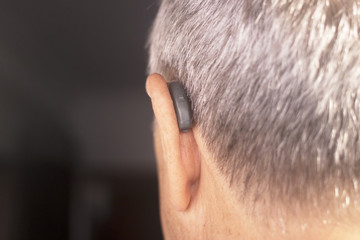 Fototapeta premium Deaf man hearing aid ear