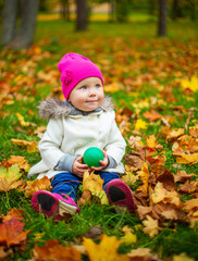 happy baby girl  in the autumn park