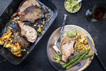 Exotically barbecue veal back racks carree roast with green asaparagus and pineapple as top view in...