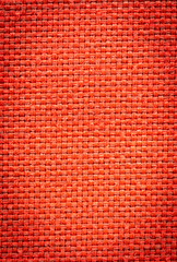 Maroon red fabric textile cloth for background texture or graphic design purposes.