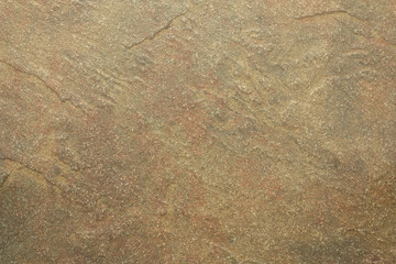 Home construction planning and design for earth tone walls and floors using natural stone and rock for building materials.