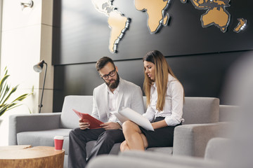 Business colleagues working © Impact Photography