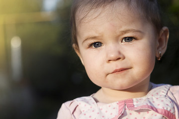 Little princess at sunset close-up