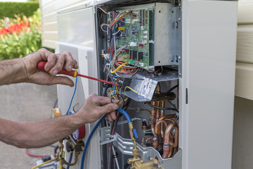 heat Pump. plumber at work installing a circulation pump