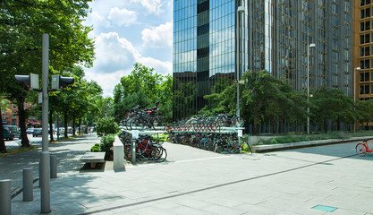City landscape in summer. A large area with modern office buildings and a large bike park. Sunny morning.