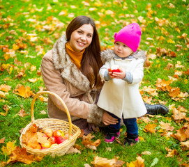 happy mother and her baby in the autumn park