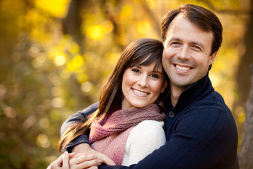 Fototapeta premium Happy Young Couple in Autumn Woods