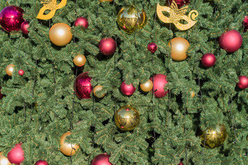 Christmas and New Year holidays background.  Christmas tree decorated with balls and garlands