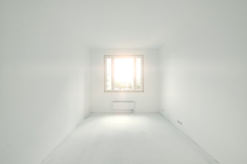 Room in a new building, sunny view outside the window