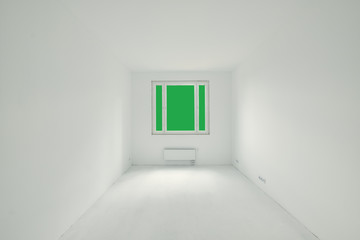 Room in a new building, green background outside the window
