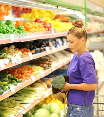 Woman buying vegetable at the market