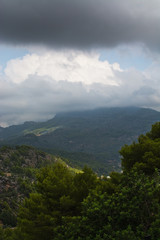 Obraz premium Majestic mountain landscape with sun and shade and green nuances