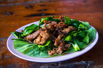 Roasted beef slice serve with spicy and sour sauce, Barbecue thai style. image for background, wallpaper and copy space
