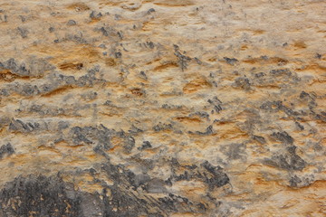 Texture of a stone wall. Vintage background. A wall of medieval buildings. Abstract pattern with a natural material