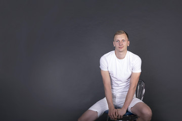 Handsome young man in a casual style clothing isolated on white background