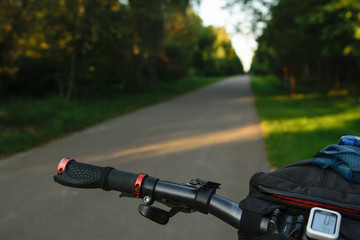 Handle bar of bicycle on the evening road