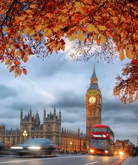 Fototapeten Buses with autumn leaves against Big Ben in London, England, UK © Tomas Marek