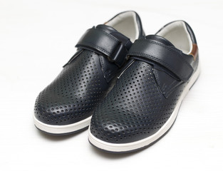 children's black shoes on a white background