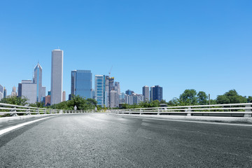 asphalt highway with modern city in chicago