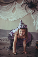 girl in the witch costume frightens.