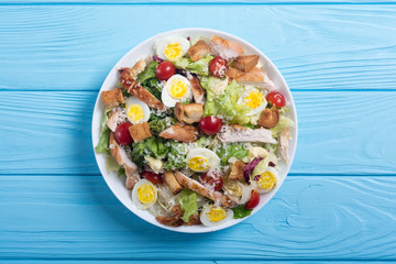 Salad ceasar with chicken , eggs and tomatoes