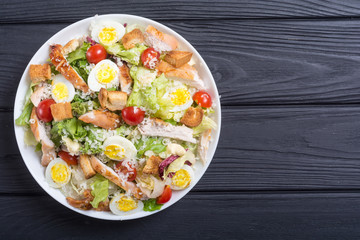 Salad ceasar with chicken , eggs and tomatoes