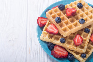 Belgian waffles with strawberry and blueberry