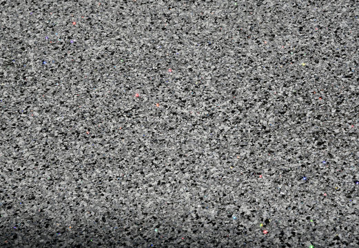 Granite surface with glitter particles