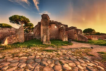 Photo sur Plexiglas Rudnes Sunset glimpse from cobblestones street in  Ancient Ostia ruins  - Rome