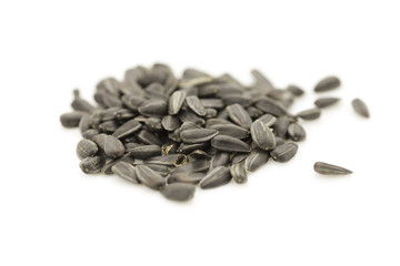fried sunflower seeds on white background
