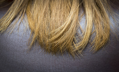 Redhead female hair on a background of brown skin