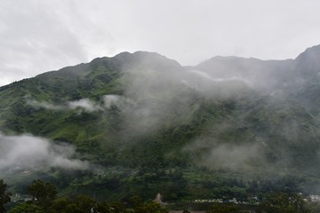 lush green mountains with clouds