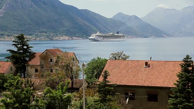 White cruise liner in the Bay of Kotor. Sunny day in Montenegro.