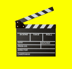 Obraz premium Movie clapper isolated on yellow background. clapper board film. slate cinema film with clipping path. cinema production. image for background, wallpaper, objects and copy space.