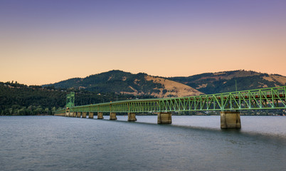 The green truss Hood River Bridge that crosses the Columbia River Gorge and connects Hood River