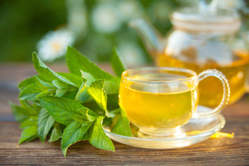 delicious green tea in a beautiful glass bowl on table