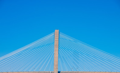 White Cables on Suspension Bridge Against Blue Skies