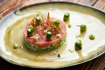 Salad with wild shrimps, young cabbage, tomato fillet and citronet sauce, close-up