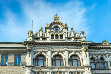 Fototapeta na wymiar The upper part of a beautiful old building in Vladivostok.