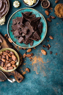 Chocolate. Dark bitter chocolate chunks, cacao butter, cocoa powder and cocoa beans. Chocolate background