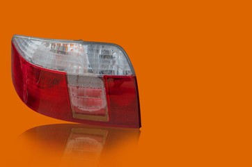 Car tail lights that are separate from the background scene white.