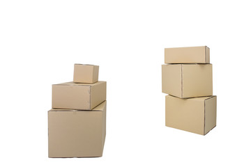 Cardboard Boxes in different sizes stacked boxes isolated on white backgrouns