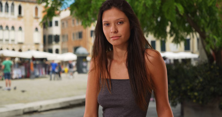 Beautiful Caucasian girl on street with tourism in Venice hair blowing in wind