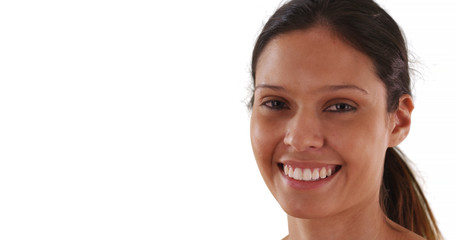 Close up portrait of cheerful Caucasian woman laughing on white background