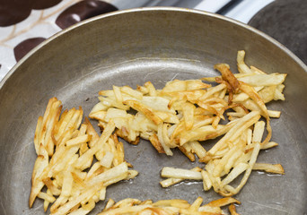 French fries fried in a pan